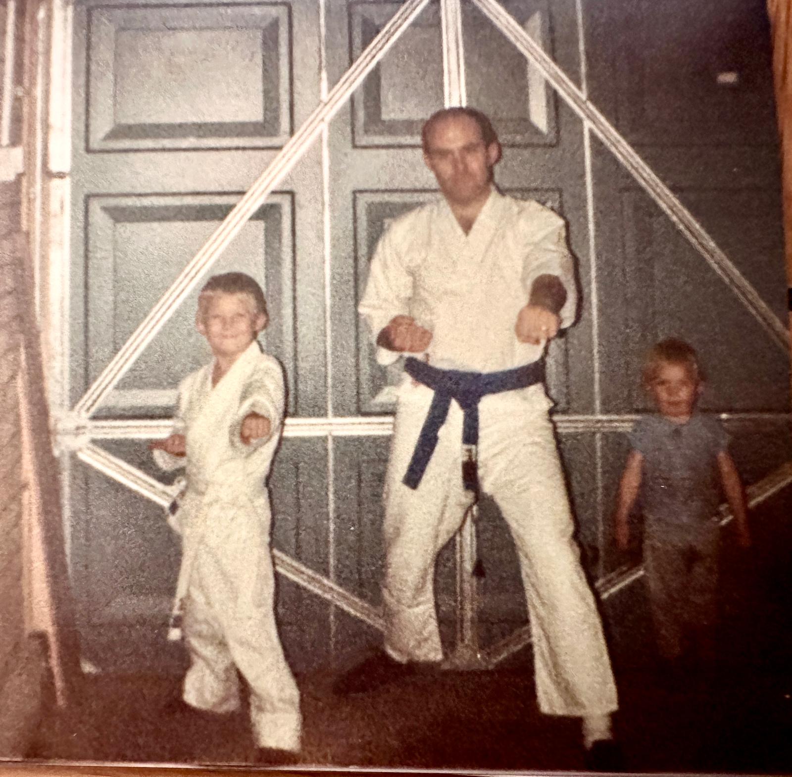 Joe Sheridan teaching young Lee karate, mid-1980s family photo