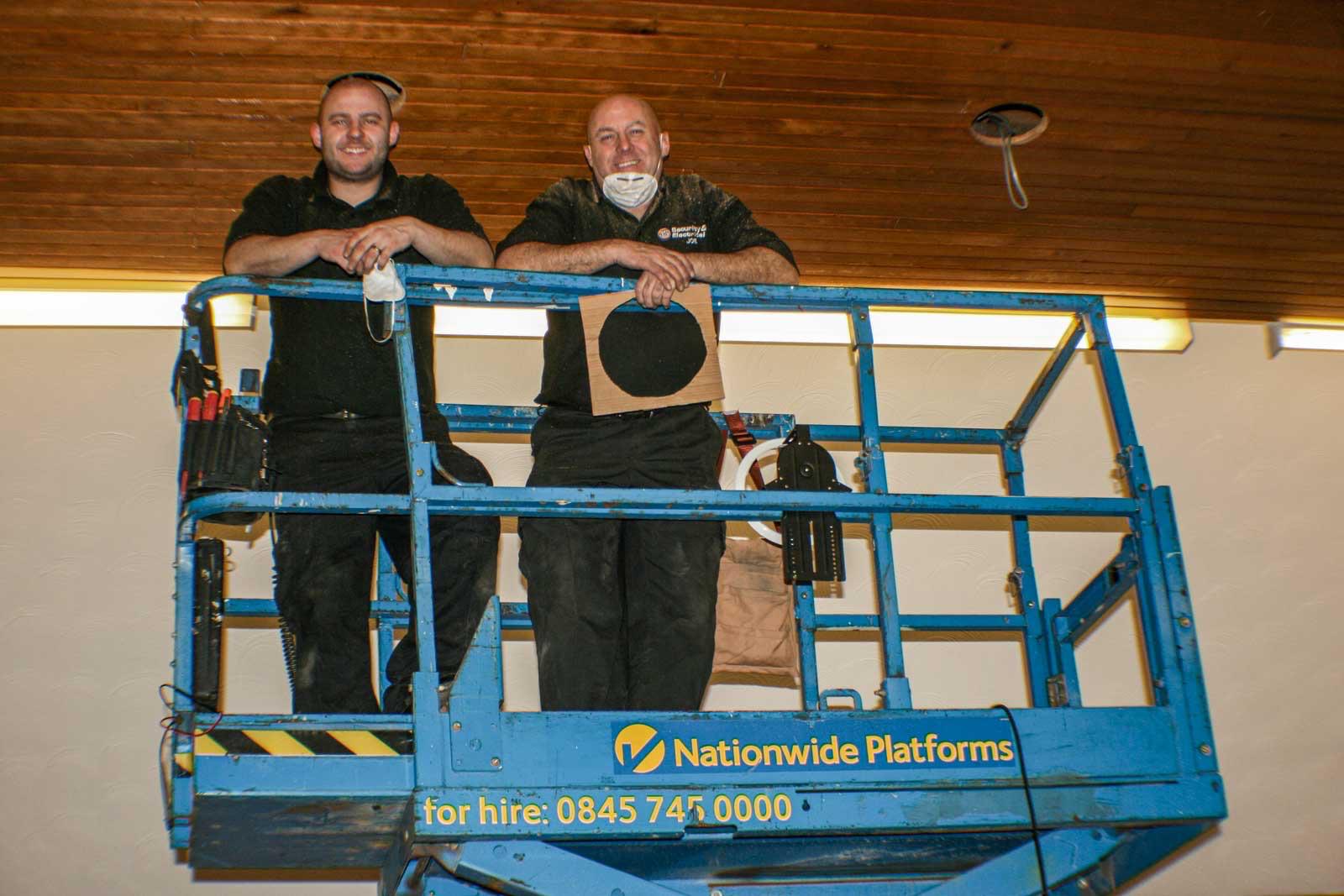 AMP's own certified engineers working at height on an install